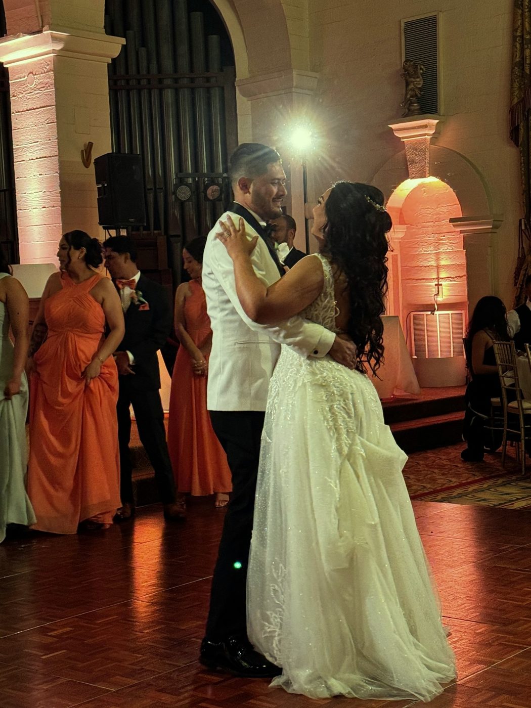 A newly married couple dancing