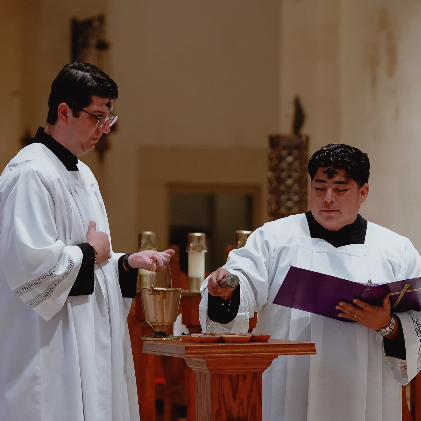 Two seminarians serving at the altar on Ash Wednesday