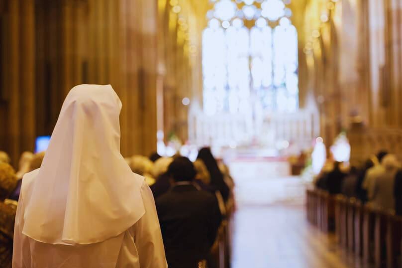 A religious sister in prayer