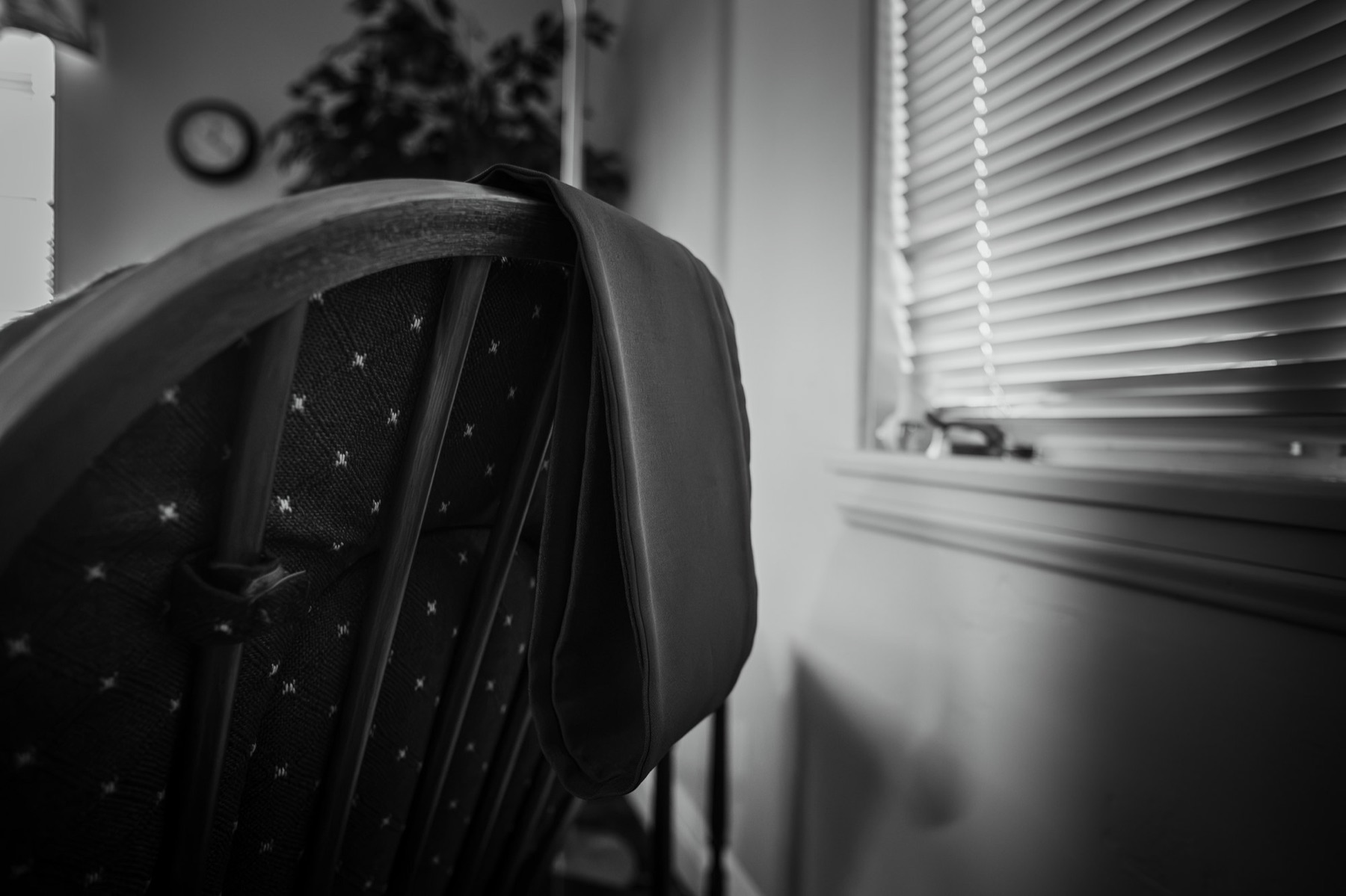 A purple stole draped over a chair in the confessional