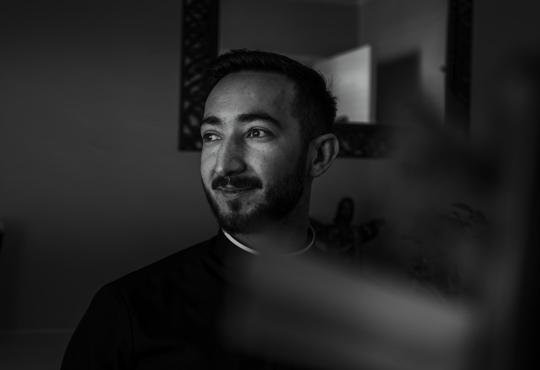 Father Larry partly in shadow