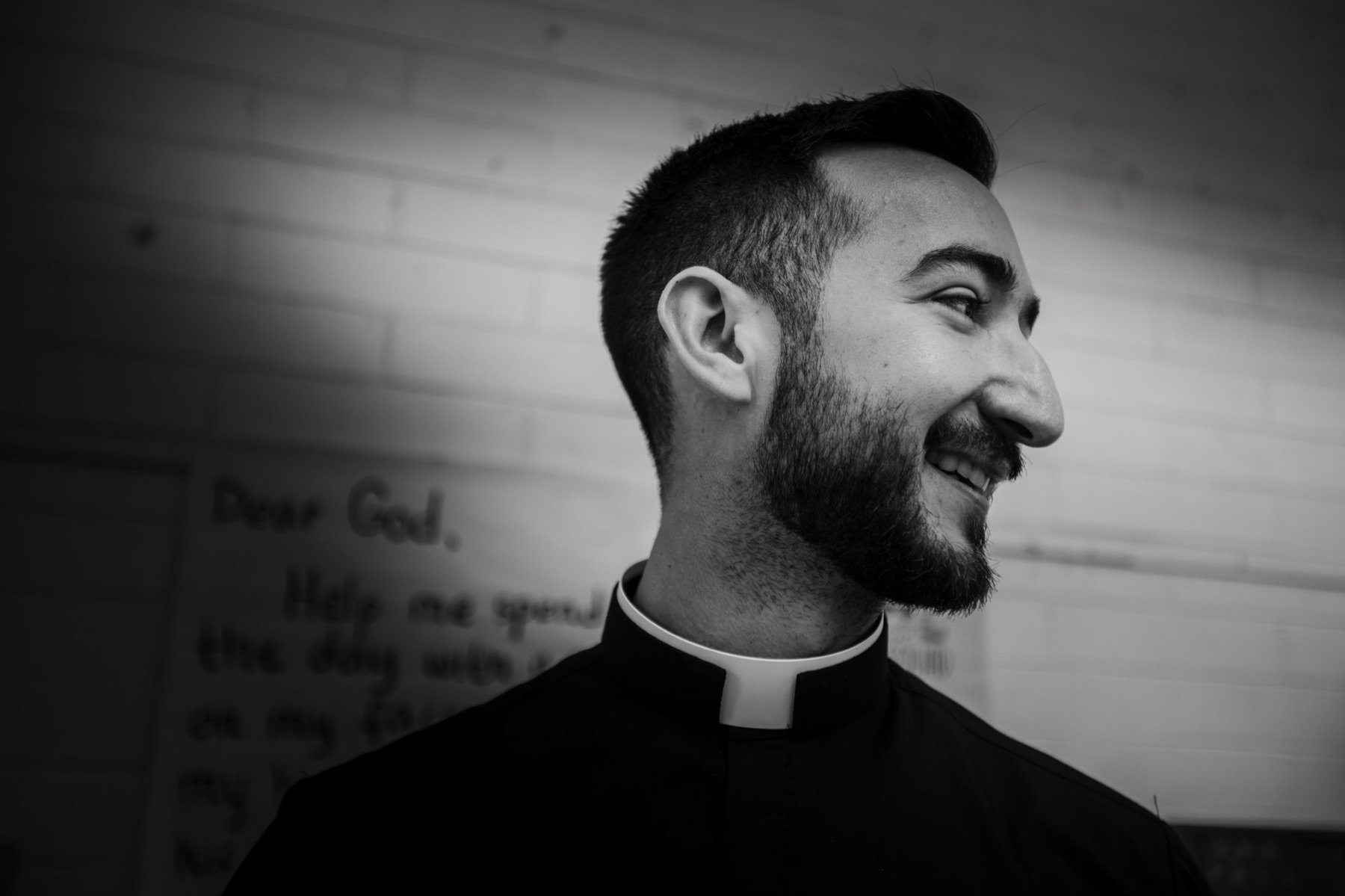 Father Larry smiles