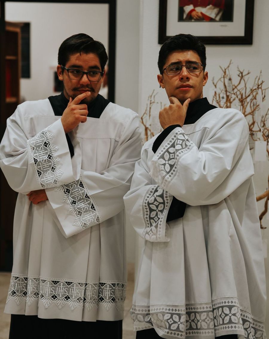 Seminarians in cassock and surplice at Serra House